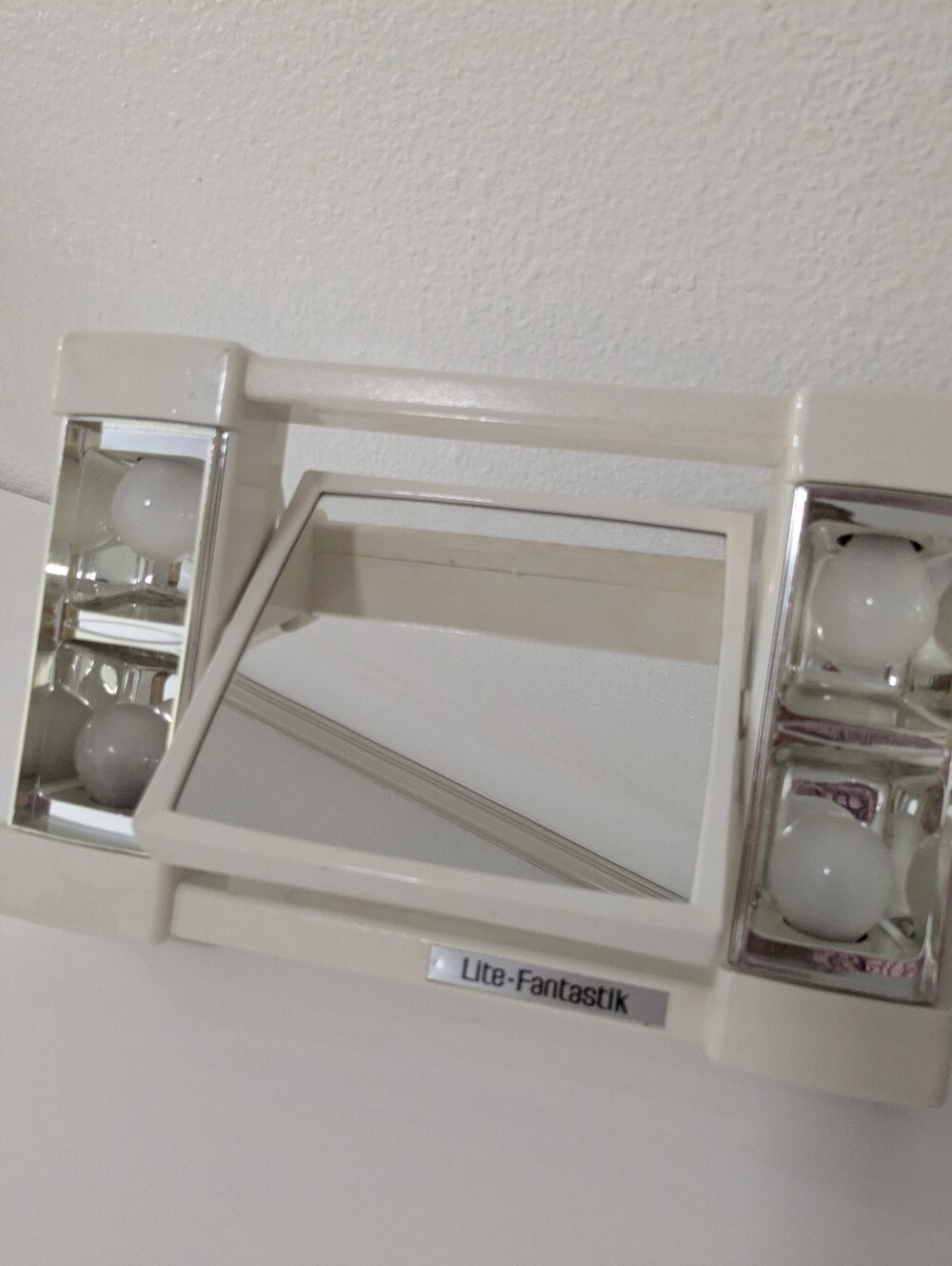 Lite-Fantastik lighted makeup mirror by Faces West Inc., Santa Monica, Calif.